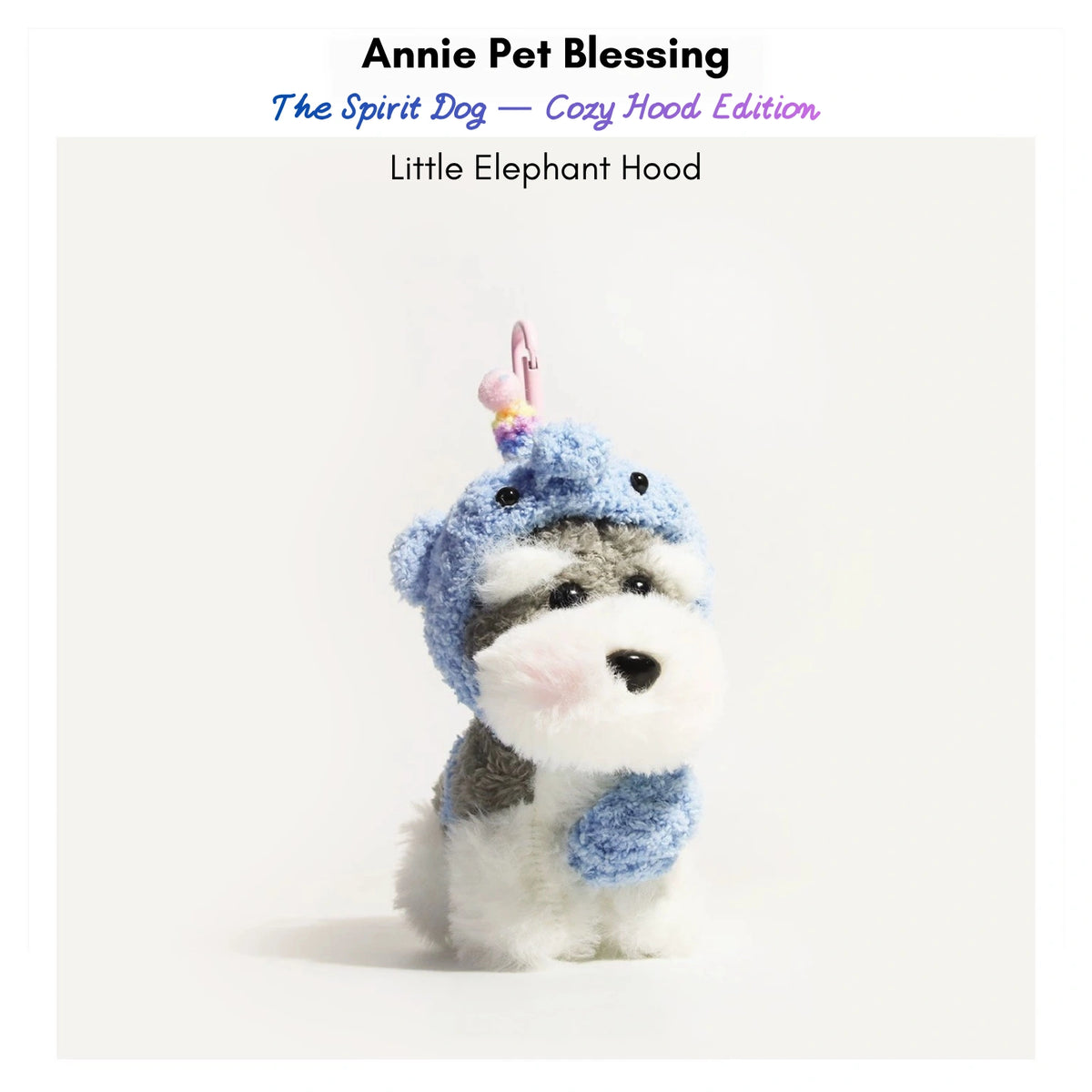 Grey-and-white plush Spirit Dog keychain wearing a blue elephant hood and wrap