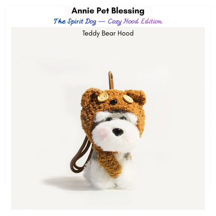 Grey-and-white plush Spirit Dog keychain wearing a brown teddy bear hood and scarf
