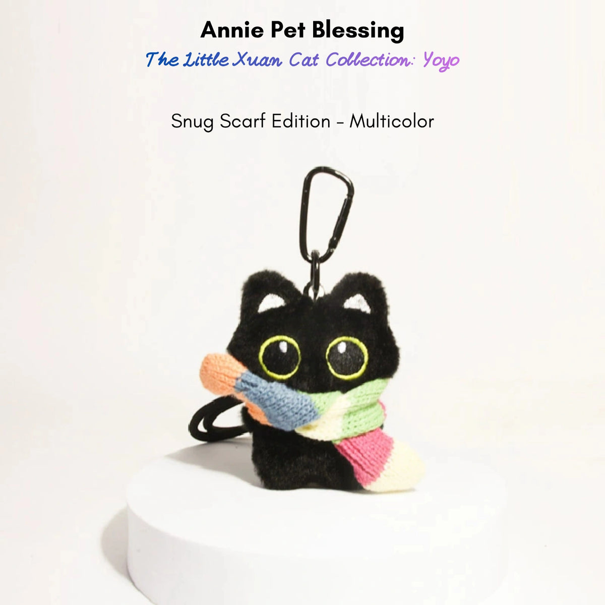 Black plush Yoyo keychain wearing a multicolor striped knitted scarf