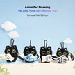 Four black plush Yoyo keychains each holding a different plush fish design