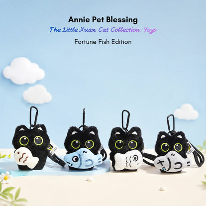 Four black plush Yoyo keychains each holding a different plush fish design
