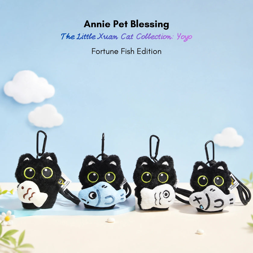 Four black plush Yoyo keychains each holding a different plush fish design