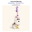Grey-and-white plush Spirit Dog keychain wearing a lavender crocheted flower and collar, Lavender Blossom edition