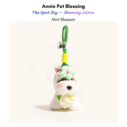 Grey-and-white plush Spirit Dog keychain wearing a mint-green crocheted flower and matching collar, Mint Blossom edition