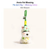 Grey-and-white plush Spirit Dog keychain wearing a mint-green crocheted flower and matching collar, Mint Blossom edition