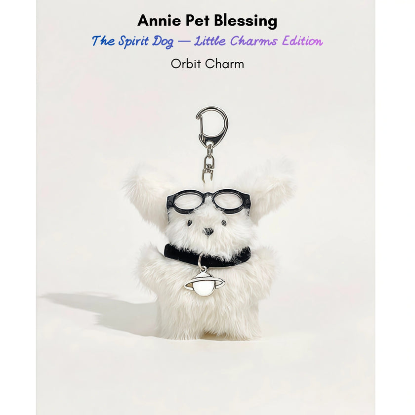 White fluffy plush charm keychain wearing glasses and a collar with a planet-shaped silver charm