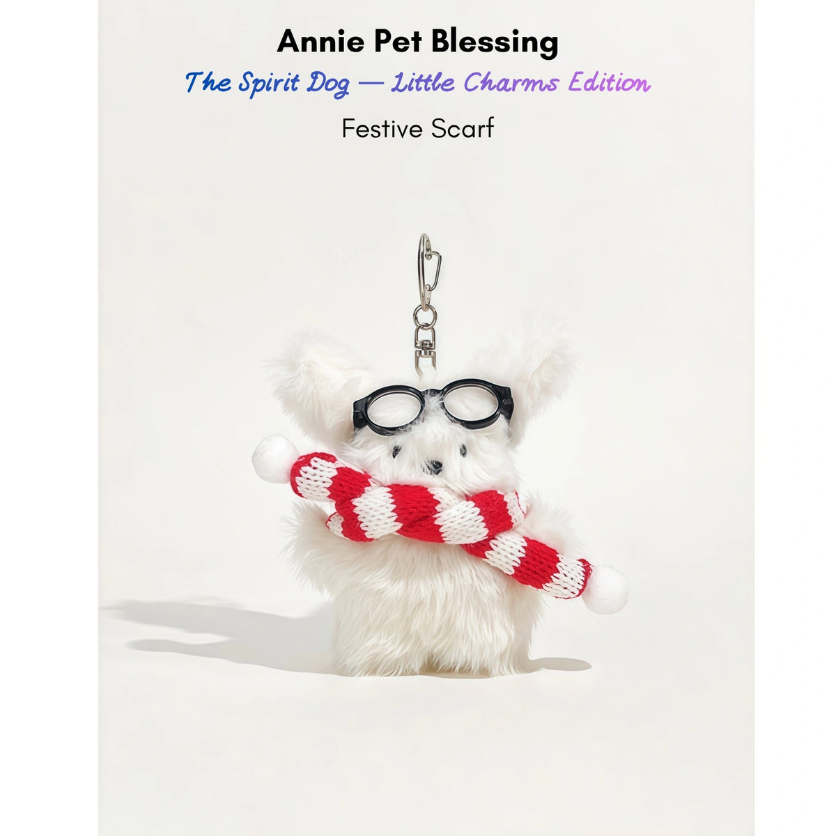 White fluffy plush charm keychain wearing glasses and a red-and-white striped scarf