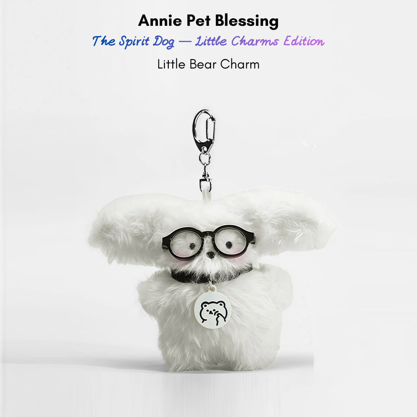 White fluffy plush charm keychain wearing glasses and a collar with a bear-shaped silver charm