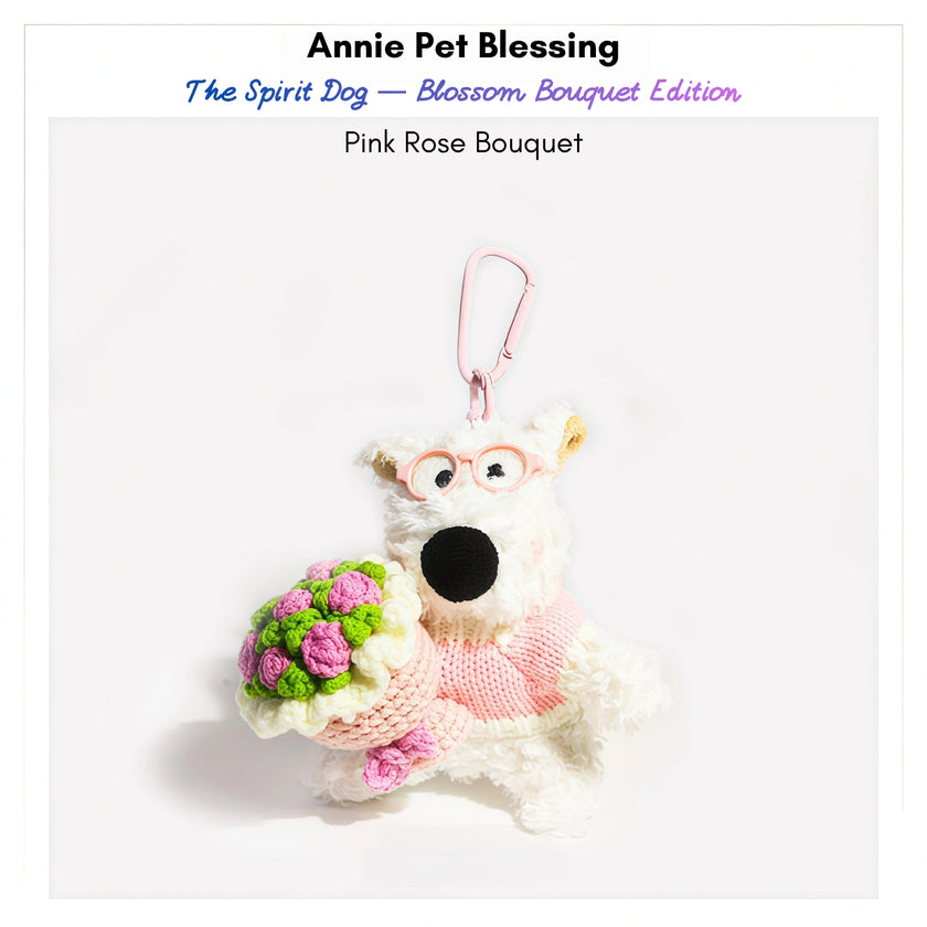 Westie plush keychain wearing a pink sweater and glasses, holding a crocheted pink rose bouquet