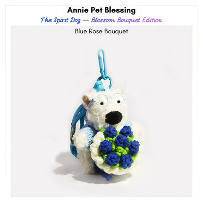 Westie plush keychain wearing a blue sweater and glasses, holding a crocheted blue rose bouquet