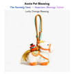 White plush Heavenly Steed horse keychain with an orange bridle, holding an orange bundle charm
