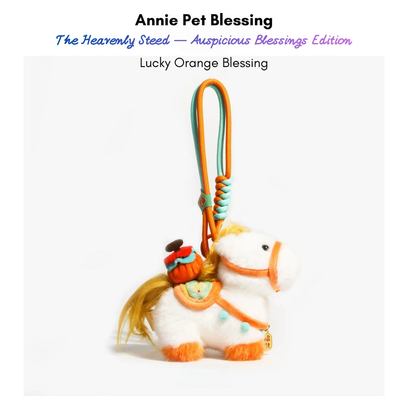 White plush Heavenly Steed horse keychain with an orange bridle, holding an orange bundle charm