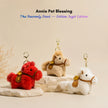 Three fluffy pom-pom Heavenly Steed horse keychains in red, tan, and white, each with a gold ingot charm