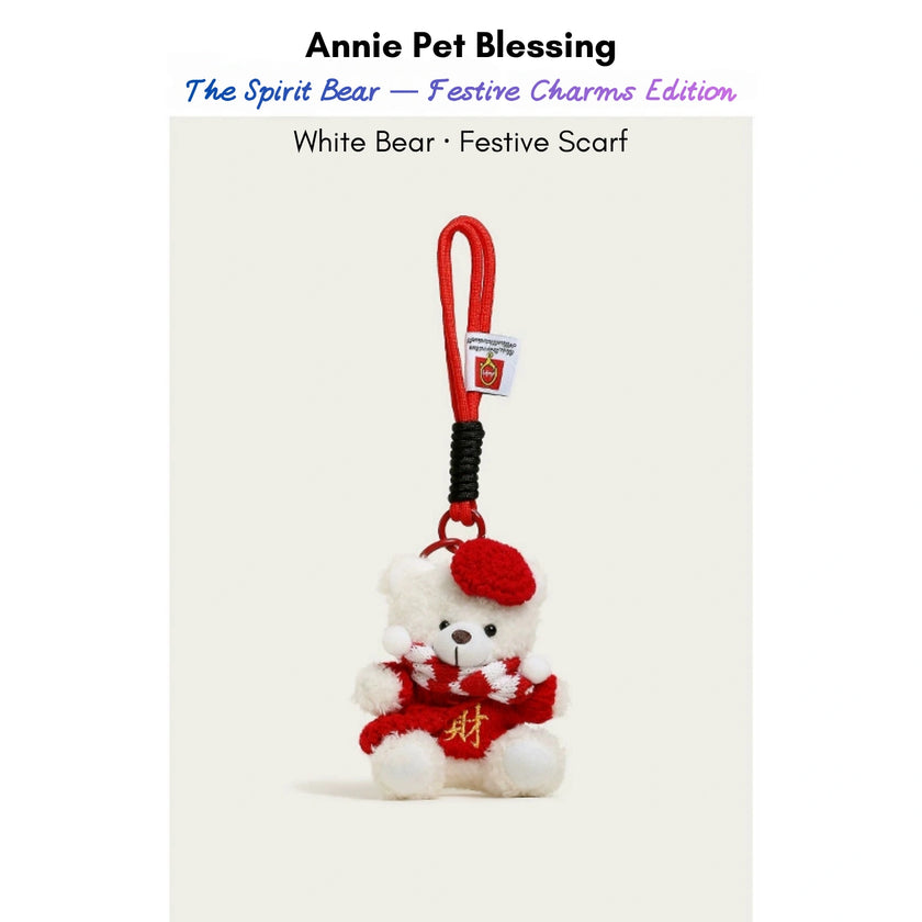 White plush Spirit Bear keychain wearing a red beret and scarf with a gold character, Festive Scarf edition