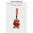 Brown plush Spirit Bear keychain wearing goggles and a red sweater, holding a Tanghulu charm