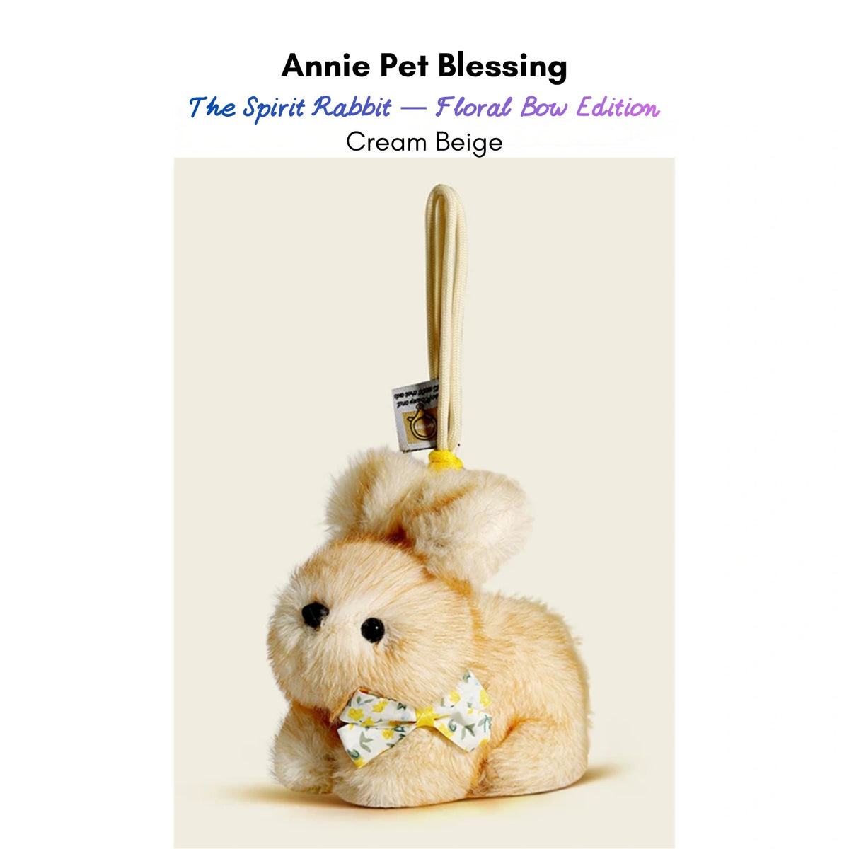 Cream plush Spirit Rabbit keychain wearing a yellow floral-print bow
