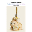 Cream plush Spirit Rabbit keychain wearing a yellow floral-print bow