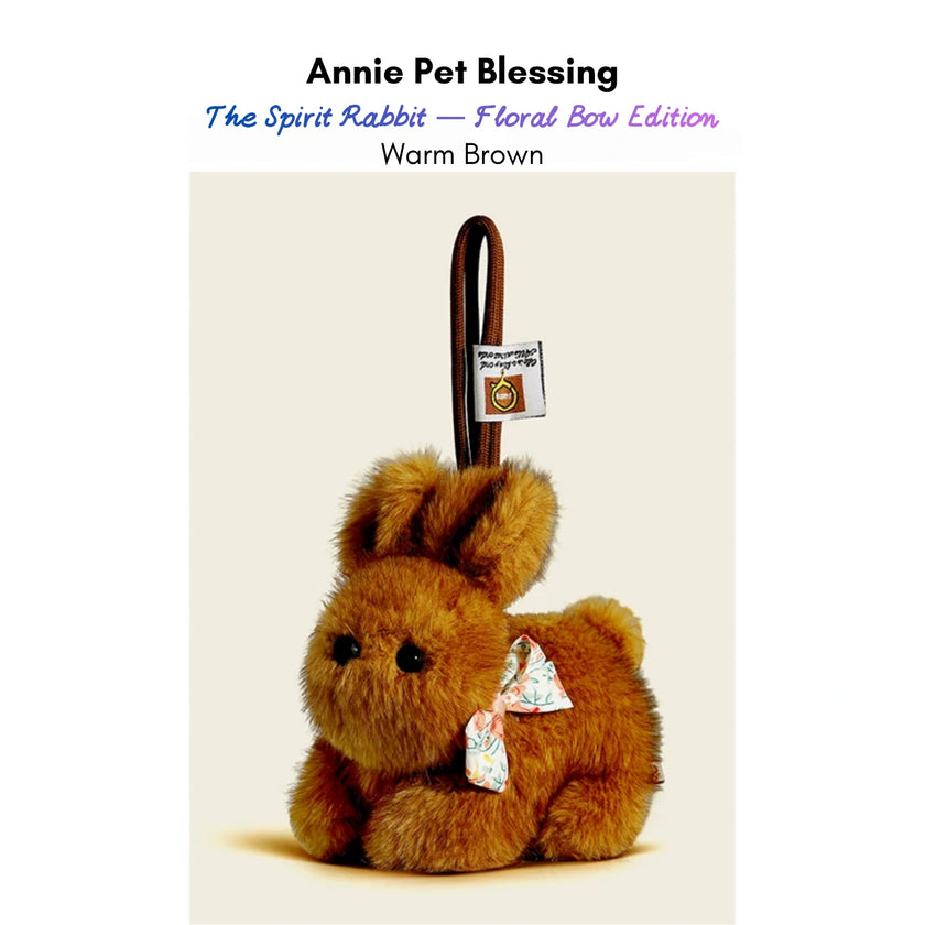 Brown plush Spirit Rabbit keychain wearing a floral-print bow