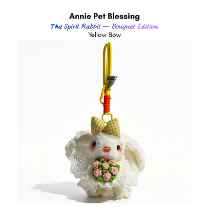 White plush Spirit Rabbit keychain wearing a yellow gingham bow, holding a pink rose bouquet