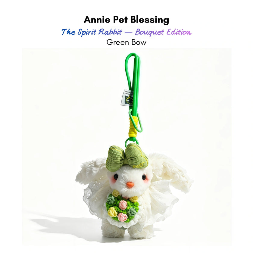 White plush Spirit Rabbit keychain wearing a green bow, holding a yellow and pink rose bouquet