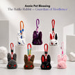 Seven plush Battle Rabbit head keychains in different colors, each with stitched angry expressions