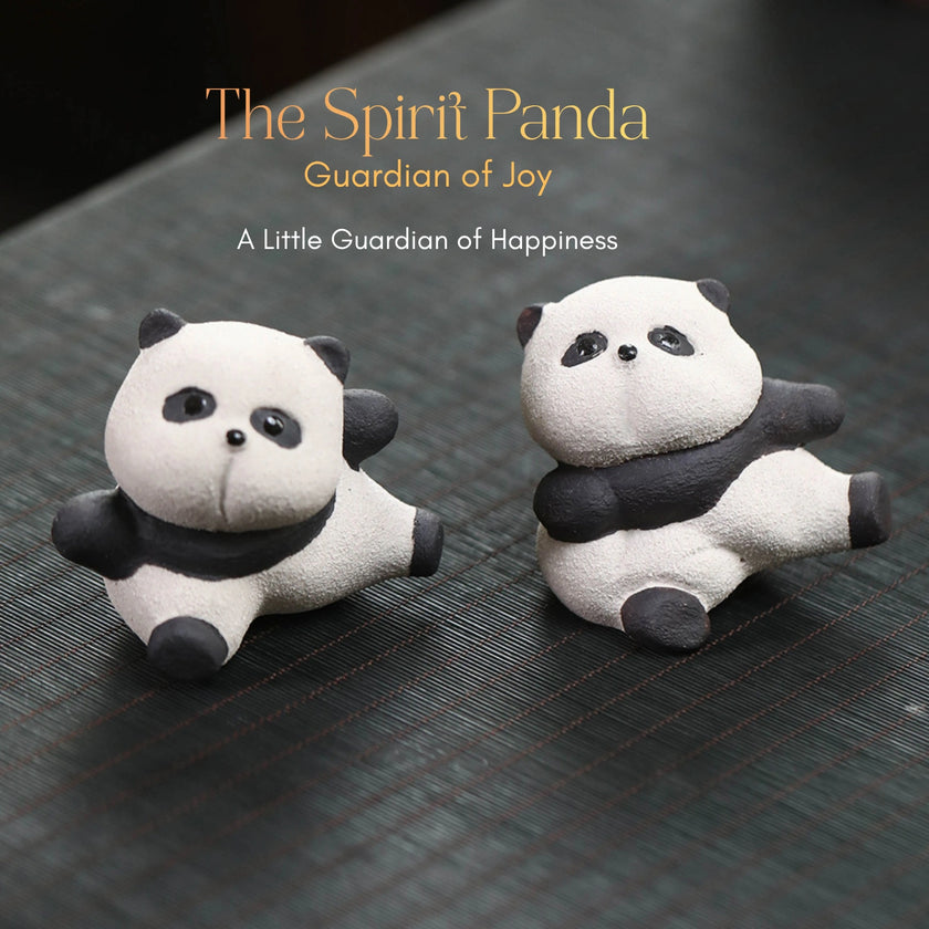 Two textured ceramic Spirit Panda figurines in a seated punch pose, black and white