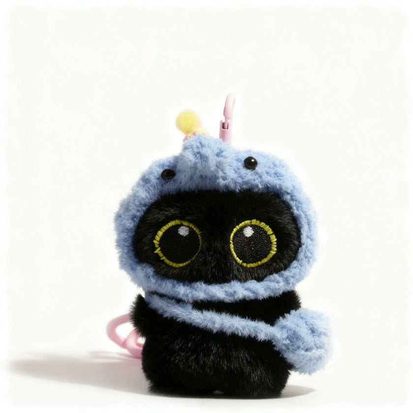 Yoyo plush keychain wearing a light blue elephant hood, front view