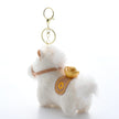 Close-up rear view of a white plush Heavenly Steed horse keychain with a gold-embroidered saddle blanket