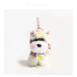 Grey-and-white plush Spirit Dog keychain wearing a peach crocheted flower headpiece and bib