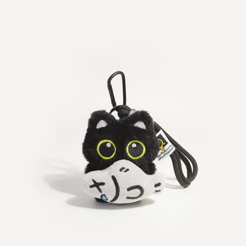 Close-up of a black plush Yoyo keychain holding the crying-face Cloudy Fish charm