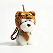 Close-up of a grey-and-white plush Spirit Dog keychain wearing a brown teddy bear hood