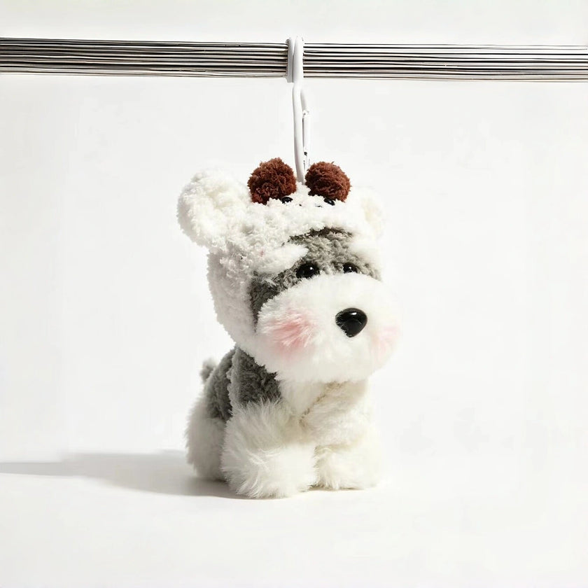 Grey-and-white plush Spirit Dog keychain wearing a white knitted hood with brown pom-pom ears