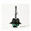 Close-up of a black plush bat-winged Yoyo keychain wearing goggles and a green-and-white striped scarf