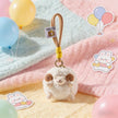 White plush Spirit Sheep keychain resting on a pastel blanket with balloons and stickers