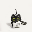 Back-angle close-up of a black plush Yoyo keychain holding the Cloudy Fish charm