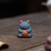 Close-up of a ceramic Spirit Dragon figurine in blue with reddish-brown antlers and a brown belly patch