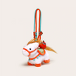 Four plush Heavenly Steed horse keychains displayed on white pedestal blocks of varying heights